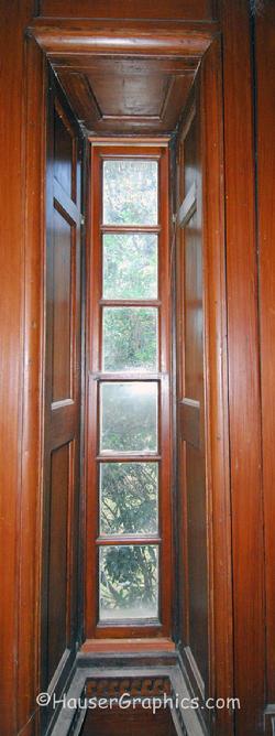 Palladian side window in Fenwick Hall with the wood paneling detail of the window surround. 